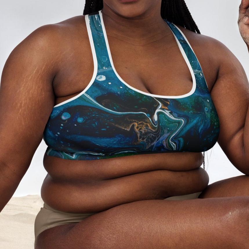 Plus-sized model wearing High-Performance Sports Bra with white piping and white tights. Front view with whole body visible in frame.