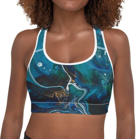 High-performance padded sports bra designed for active women and crafted with moisture-wicking fabric, with white pipping.