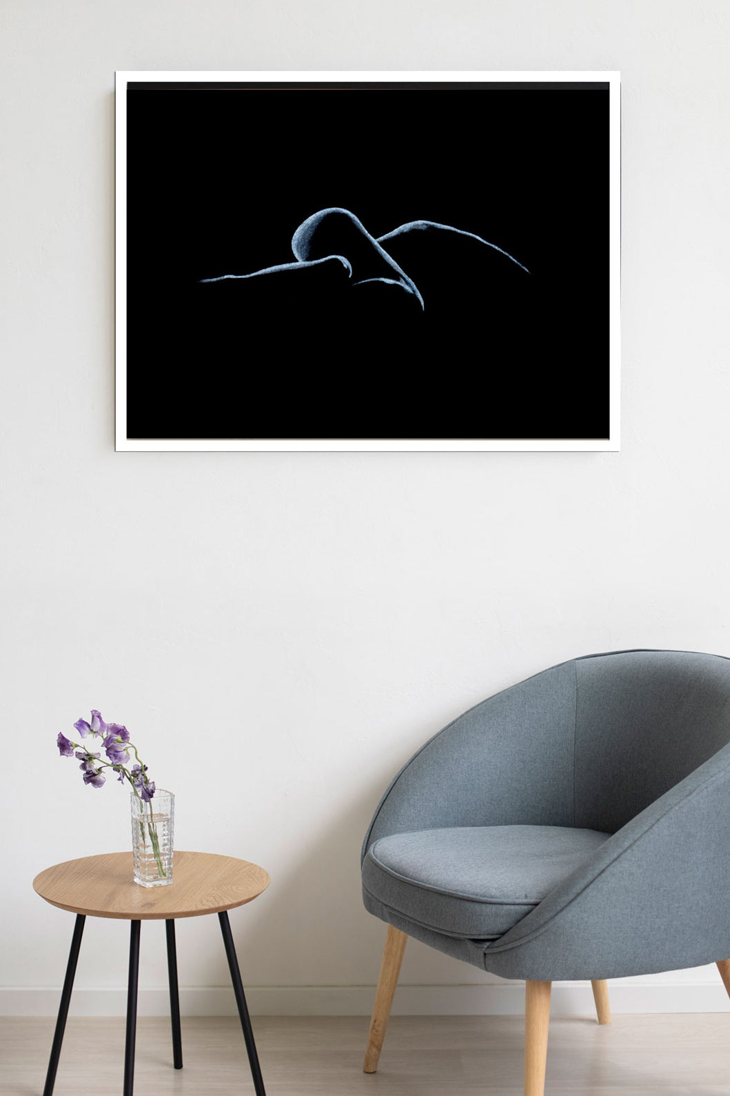 Pastel figure drawing in white frame displayed in seating area. Available on canvas, poster, and framed options, offered in multiple sizes and frame colors.