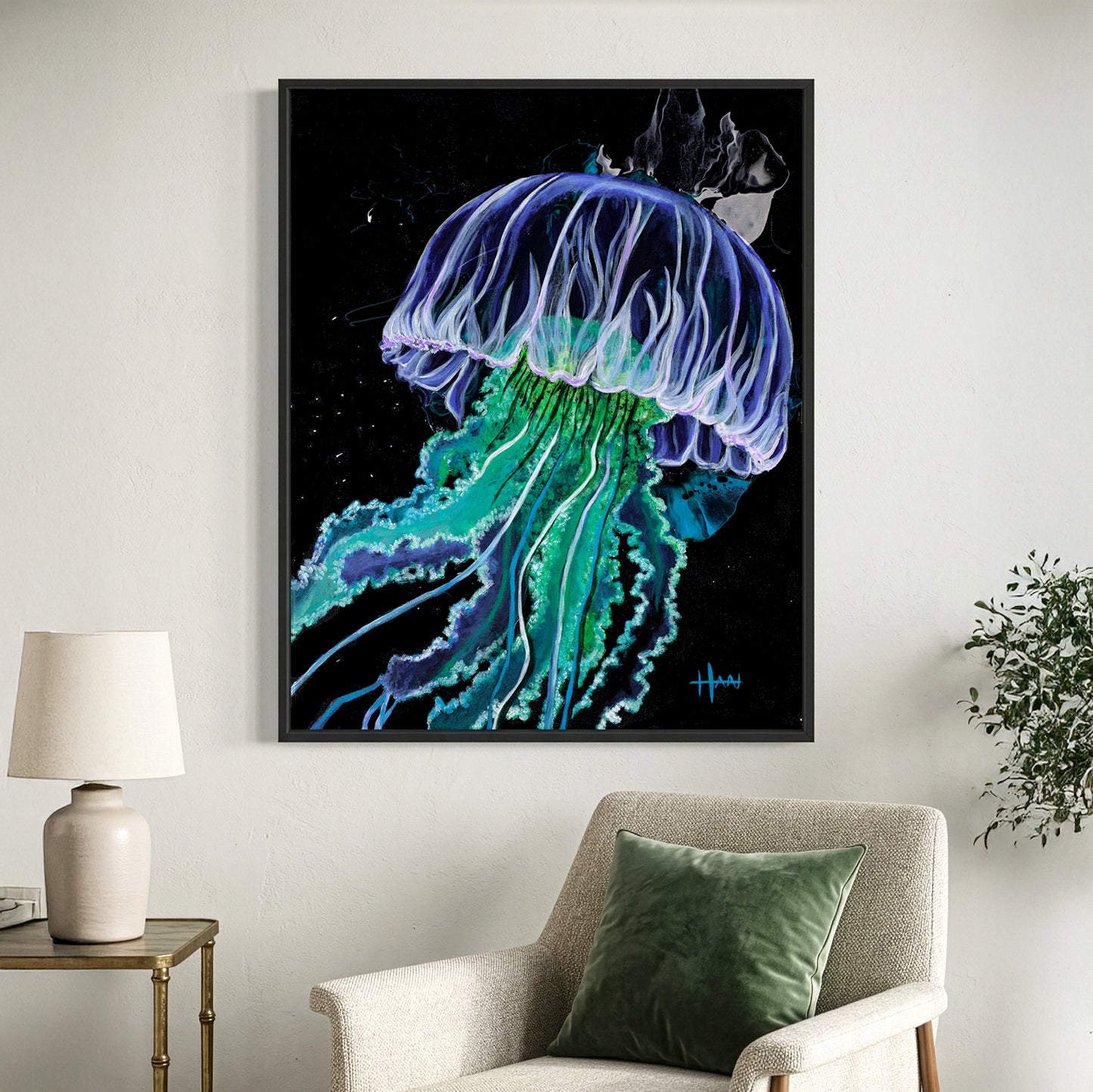Framed artwork of a jellyfish on a wall above a chair with a green pillow.