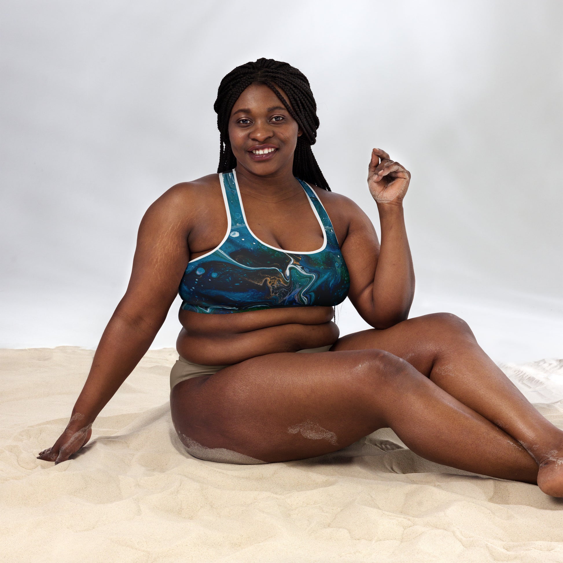 Plus-sized model wearing High-Performance Sports Bra with white piping and white tights. Front view with whole body visible in frame.