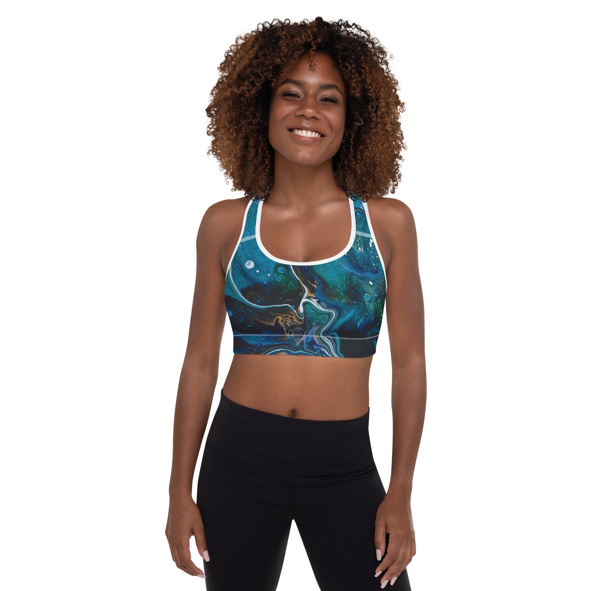 High-performance padded sports bra designed for active women and crafted with moisture-wicking fabric, with white pipping.